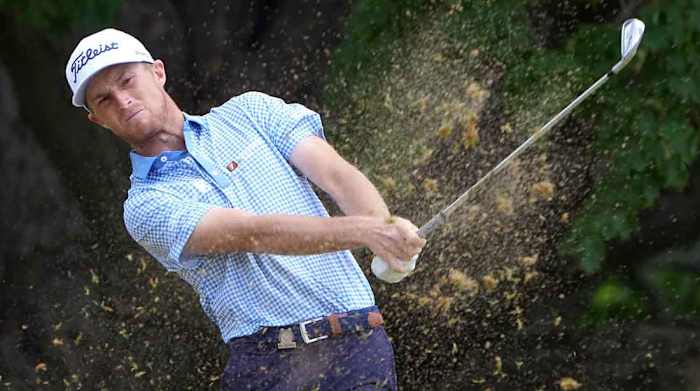 Will Zalatoris hits an iron shot in the third round of the 2022 U.S. Open.